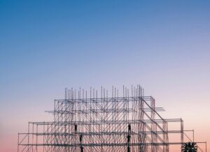 A silhouetted structure against a colorful sunset, showcasing industrial scaffolding in Sochi, Russia.